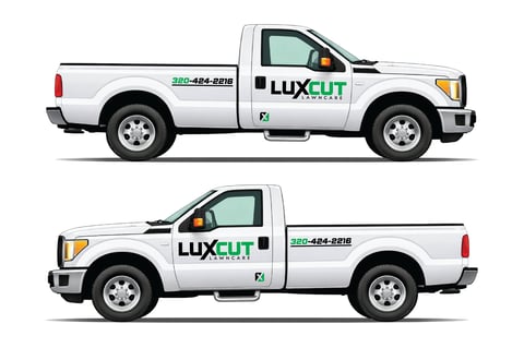 Two white Luxcut service pickup trucks shown in side profile view with logos and phone number displayed